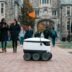Starship delivery robot crossing a university campus path